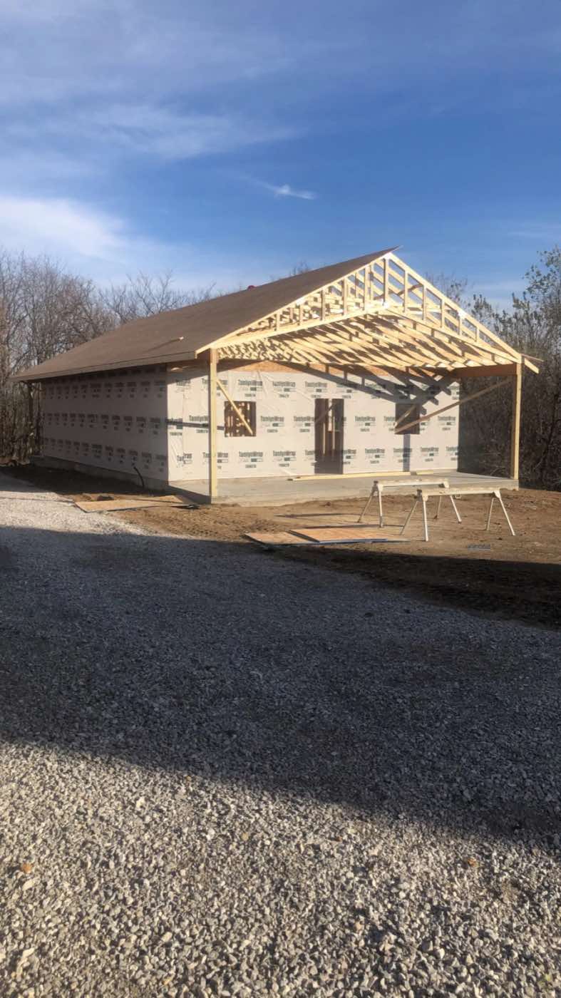 New structure with exterior walls and roof framing in progress