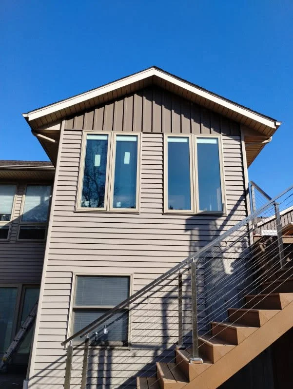 Newly installed exterior windows on a two-story home